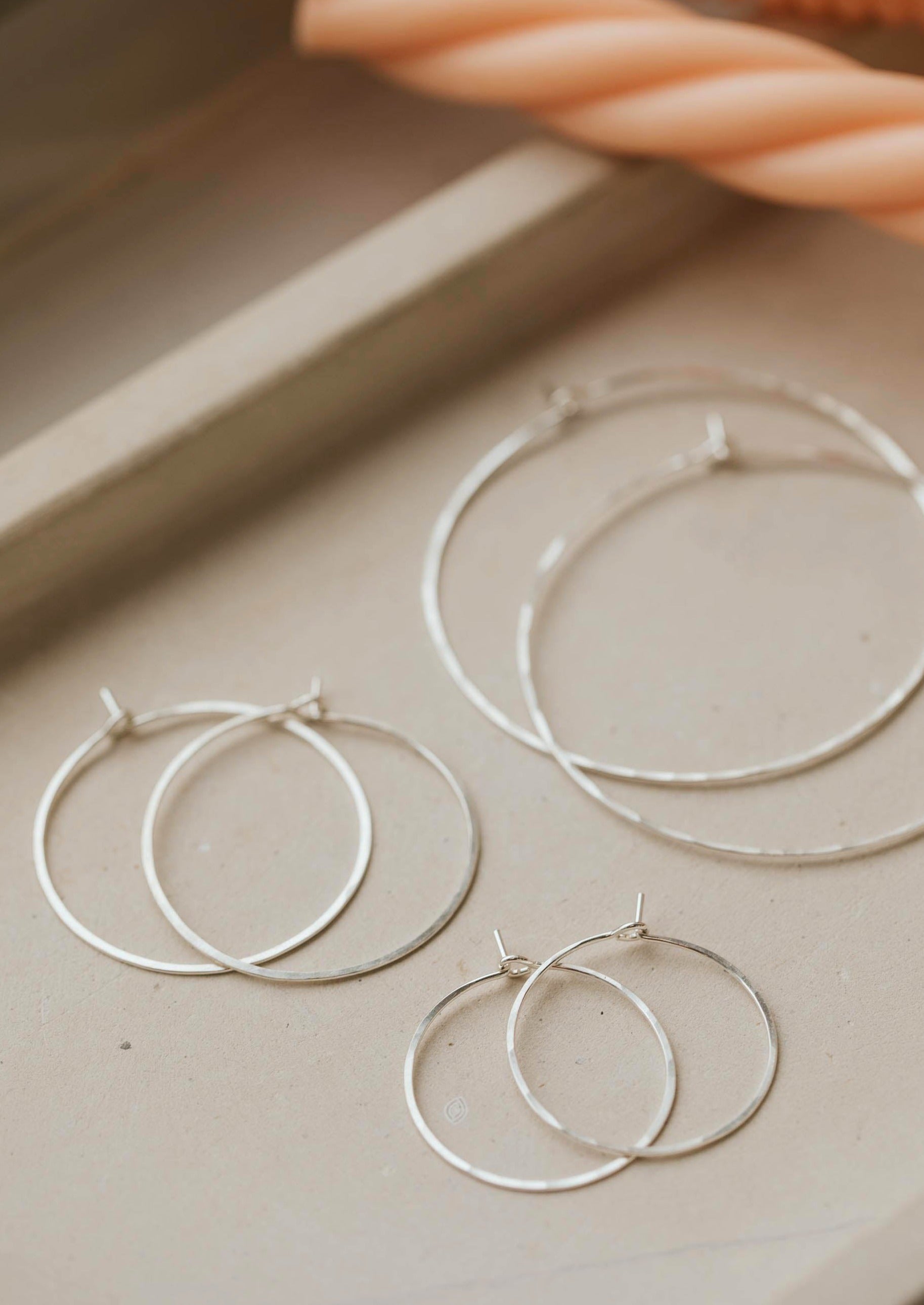 Silver hoop earrings created by Hello Adorn as thin hoop earrings for daily wear earrings in Cypress Hoops style.